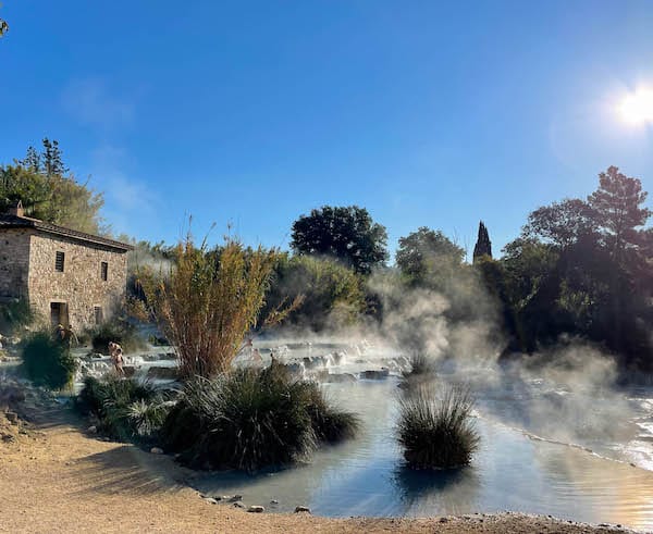 you can book a tour to see the Saturnia hot springs in italy