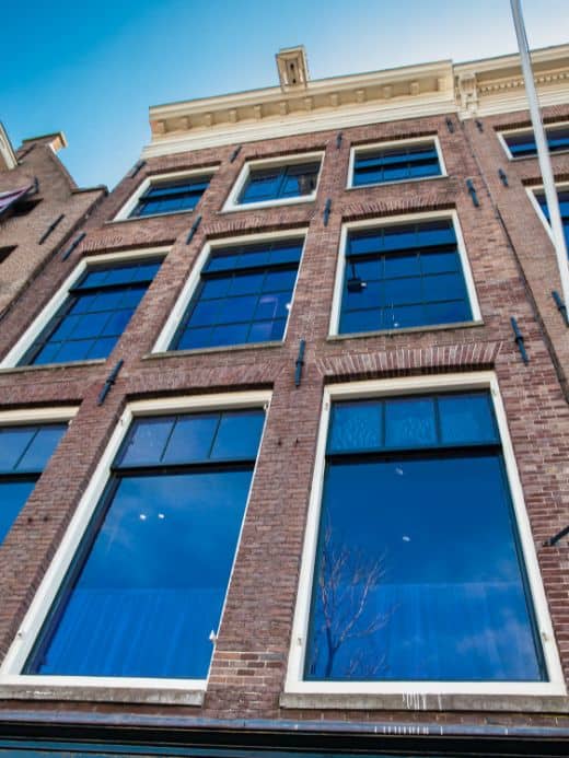 a picture of the Anne Frank house, one of the top attractions in Amsterdam